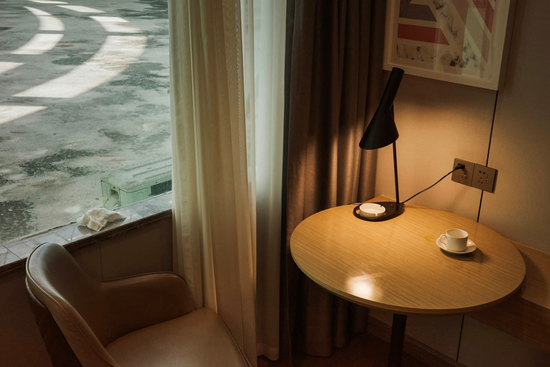 An armchair and side table by the suite window