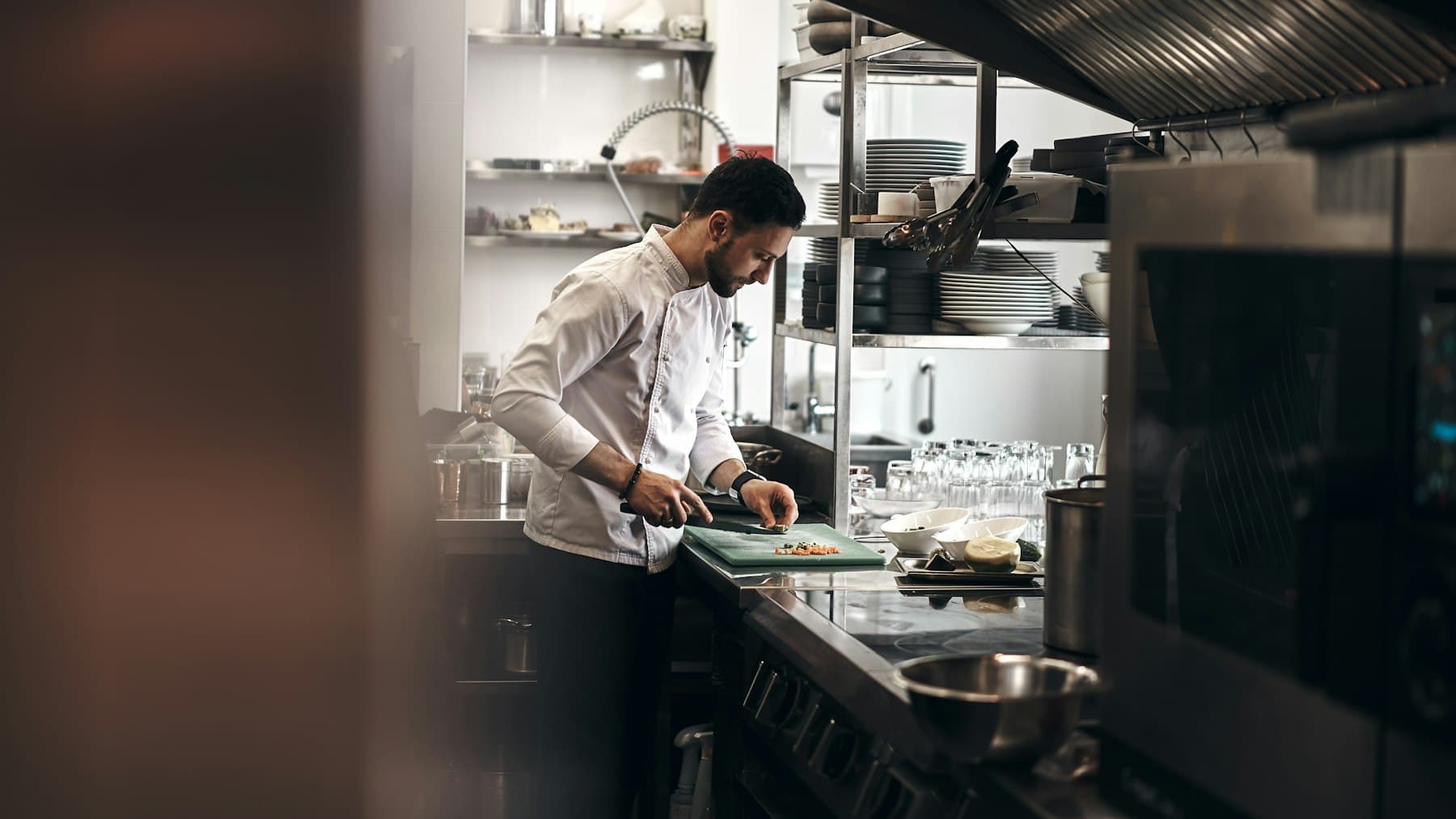 The chef at work at the restaurant kitchen range